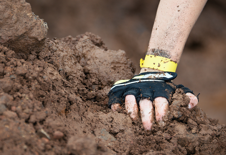 Glove in mud during a run