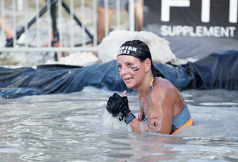 Women with wet hands during a Spartan Race