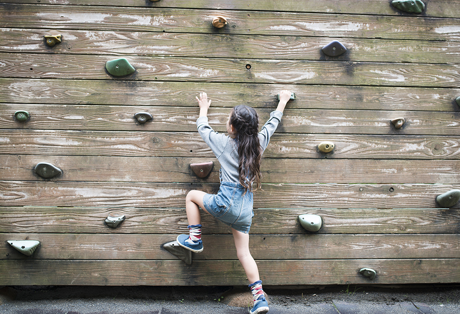 Kid climbing on wall