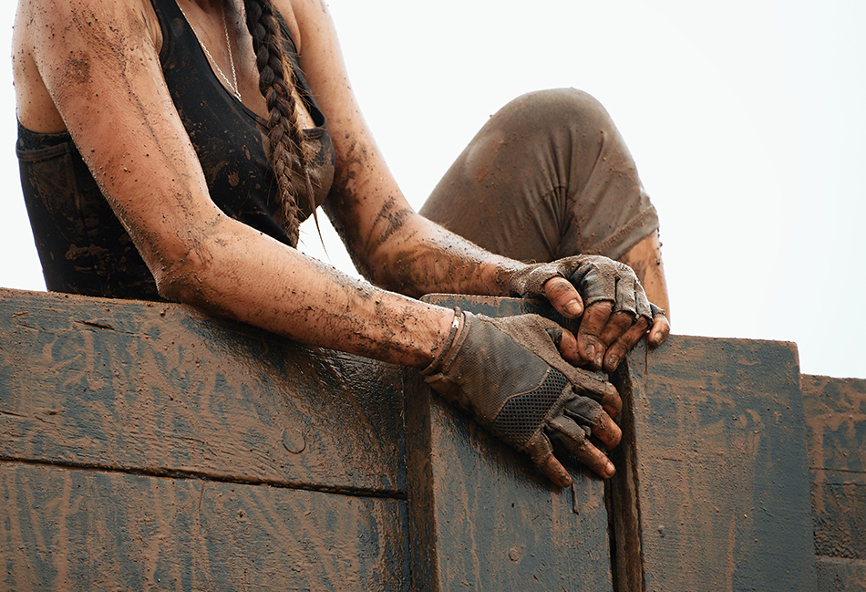 Women wearing gloves at obstacle race